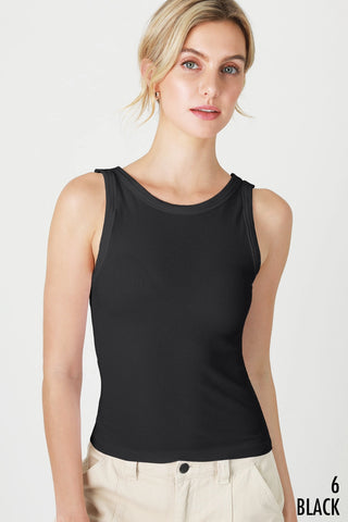 Woman wearing a black sleeveless top on a white background